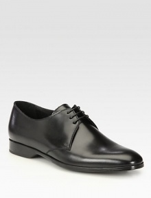 Classic lace-up oxford with a beveled heel, rendered in smooth, supple Italian leather.Leather upperLeather liningPadded insoleRubber soleMade in Italy