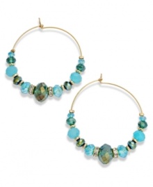 Boho-chic comes full circle. These darling c.A.K.e. by Ali Khan hoop earrings feature turquoise color glass beads and crystal accents. Approximate diameter: 2-3/4 inches.