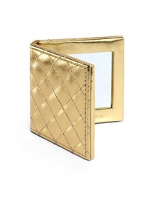 Gold fold up mirror with Saks name plate on outside of the mirror. About 6.5 X 8.5. Gold fold up mirror with Saks name plate on outside of the mirror. About 6.5 X 8.5.
