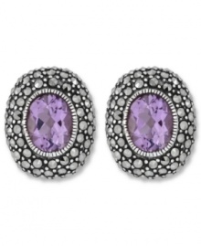 Perfect your look with polished studs. Genevieve & Grace's oval-shaped earrings feature amethyst centers (3-5/8 ct. t.w.) surrounded by glittering marcasite. Set in sterling silver. Earrings feature an omega clip-on backing for non-pierced ears. Approximate length: 3/4 inch. Approximate width: 5/8 inch. Perfect your look with polished studs. Genevieve & Grace's oval-shaped earrings feature amethyst centers (3-5/8 ct. t.w.) surrounded by glittering marcasite. Set in sterling silver. Earrings feature an omega clip-on backing for non-pierced ears. Approximate length: 3/4 inch. Approximate width: 5/8 inch.