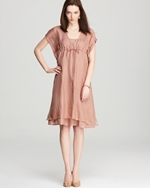 An understated blush makes a dramatic appearance on this ruffled Eileen Fisher dress. A cinched bust and delicate dipped hem lend romantic appeal. An understated blush makes a dramatic appearance on this ruffled Eileen Fisher dress. A cinched bust and delicate dipped hem lend romantic appeal.