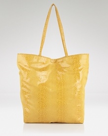 Carlos Falchi's signature tote is an exotic take on a classic shape. Microfiber with an interior pouch, this sleek style strikes an enviable balance between practicality and polish. Carlos Falchi's signature tote is an exotic take on a classic shape. Microfiber with an interior pouch, this sleek style strikes an enviable balance between practicality and polish.