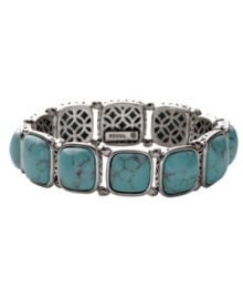 Naturally inspired. Fossil's reconstituted turquoise bracelet has an organic look and feel. Set in silver tone mixed metal with open back castings. Bracelet stretches to fit wrist. Approximate diameter: 2-1/4 inches. Naturally inspired. Fossil's reconstituted turquoise bracelet has an organic look and feel. Set in silver tone mixed metal with open back castings. Bracelet stretches to fit wrist. Approximate diameter: 2-1/4 inches.