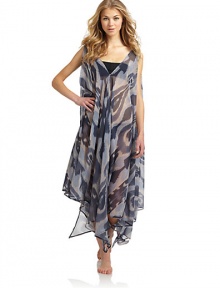 THE LOOKExotic inspired print on sheer, flowy chiffonOne dress, so many ways to wear itBelted, one-shoulder, crisscross or bring in 2 points on the hem to cinch the waistIncludes tag with styling optionsV-neckAsymmetrical hemLong side slitsTHE FITAbout 45 from shoulder to longest point of hemTHE MATERIALPolyesterCARE & ORIGINHand washMade in USAPlease note: One size fits most. THE LOOKExotic inspired print on sheer, flowy chiffonOne dress, so many ways to wear itBelted, one-shoulder, crisscross or bring in 2 points on the hem to cinch the waistIncludes tag with styling optionsV-neckAsymmetrical hemLong side slitsTHE FITAbout 45 from shoulder to longest point of hemTHE MATERIALPolyesterCARE & ORIGINHand washMade in USAPlease note: One size fits most.