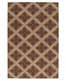 A collection of rosebuds is set in a geometric diamond design that is modern in style and romantic in color. The Carmel Sonado area rug is woven to a thick pile height for supreme softness and a detailed finish that enhances the décor of any room.