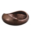 Add allure and sophistication to any event with Nambe serveware and serving dishes. Crafted of alloy and finished in beautiful bronze, this Heritage pebble bowl from Nambe combines old-world elegance with a large, modern shape for easy serving in style.