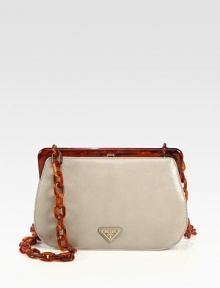 Leather in a tortoise-inspired frame-top silhouette.Plexiglas® chain strap, 19½ dropPlexiglas® frame topSpring hinge closureLogo-engraved claspGold-plated hardwareOne inside zip pocketOne inside open pocketNappa leather lining10W X 6½H X 2½DImported Leather in a tortoise-inspired frame-top silhouette.Plexiglas® chain strap, 19½ dropPlexiglas® frame topSpring hinge closureLogo-engraved claspGold-plated hardwareOne inside zip pocketOne inside open pocketNappa leather lining10W X 6½H X 2½DImported