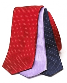 A wide silk tie embellished with a tonal pindot print. A wide silk tie embellished with a tonal pindot print.