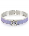 Slink into something new. This hinged bangle bracelet from Betsey Johnson is crafted from silver-tone mixed metal with purple glitter details and glass crystal accents to enhance the animal attraction.Approximate diameter: 2-1/4 inches.