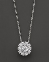 White gold diamond flower cluster pendant. With signature ruby accent. Designed by Roberto Coin.