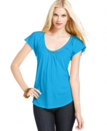 Flirty flutter sleeves and brilliant beading make up a fun petite tee from Calvin Klein Jeans! Wear with your favorite denim for a bright weekend look. Flirty flutter sleeves and brilliant beading make up a fun petite tee from Calvin Klein Jeans! Wear with your favorite denim for a bright weekend look.