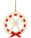 All wrapped up in a holiday bow, this graceful wreath ornament makes a memorable gift for 2012. With carved candy canes, holly and pretty scrolling detail in Lenox porcelain.