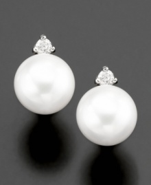 Capture the beauty of the ocean with Belle de Mer's gorgeous cultured freshwater pearl stud earrings (6-1/2-7 mm) complete with diamond accents set in 14k gold. Capture the beauty of the ocean with Belle de Mer's gorgeous cultured freshwater pearl stud earrings (6-1/2-7 mm) complete with diamond accents set in 14k gold.