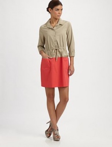 A fashion hybrid featuring the tailoring of a button-down and the flair of a classic dress. Collar neckButton frontDrawstring waistWaist dartsZipper detail on front pocketsAbout 33 from shoulder to hem67% cotton/28% polyester/5% elastaneDry cleanImportedModel shown is 5'9½ (176cm) wearing US size 4. OUR FIT MODEL RECOMMENDS ordering true size. 
