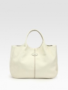 Butter-smooth leather adds a touch of luxury to this incredibly roomy carryall.Double top handles, 5½ dropDetachable shoulder strap, 22½ dropTop snap closureProtective metal feetOne inside zip pocketFully lined16½W X 11H X 5¼DMade in Italy Butter-smooth leather adds a touch of luxury to this incredibly roomy carryall.Double top handles, 5½ dropDetachable shoulder strap, 22½ dropTop snap closureProtective metal feetOne inside zip pocketFully lined16½W X 11H X 5¼DMade in Italy