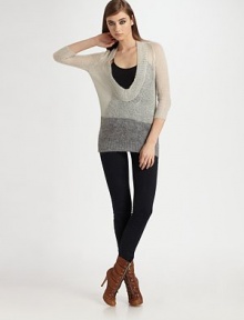 A featherweight blend of mohair and wool in an ultra-low O-neck pullover.Three-quarter sleevesRibbed trimAbout 30 from shoulder to hem67% mohair/30% polyamide/3% woolDry cleanImported A featherweight blend of mohair and wool in an ultra-low O-neck pullover.Three-quarter sleevesRibbed trimAbout 30 from shoulder to hem67% mohair/30% polyamide/3% woolDry cleanImported
