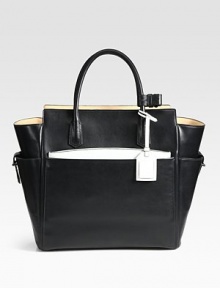 Function and luxury combine in this top-handle carryall, crafted from glovetan leather. Double top handles, 5 dropFour outside open pocketsProtective metal feetTwo inside zip pocketsInner zip pouchCotton lining18W X 13¾H X 5½DImported Function and luxury combine in this top-handle carryall, crafted from glovetan leather. Double top handles, 5 dropFour outside open pocketsProtective metal feetTwo inside zip pocketsInner zip pouchCotton lining18W X 13¾H X 5½DImported