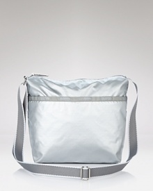 Shimmery and sporty. LeSportsac's nylon cross body bag is a no-sweat extra. Carry it to to spice up an athletic look. Shimmery and sporty. LeSportsac's nylon cross body bag is a no-sweat extra. Carry it to to spice up an athletic look.