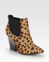 A strong stacked heel lifts this feline-inspired ankle boot of leopard-print calf hair, with leather trim and easy elastic panels. Stacked heel, 3¾ (95mm)Leopard-print calf hair upper with leather trim and side elastic panelsPull-on styleLeather lining and solePadded insoleImported