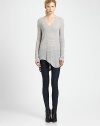 From the HELMUT capsule collection. Lengthy sweater takes on a modern silhouette with subtle distressing, dropped shoulders and an uneven hem. V-neckDropped shouldersLong sleevesAsymmetrical shirttail hem hits below hipsCotton/linen/nylonDry cleanImportedModel shown is 5'11 (178cm) wearing US size Small.