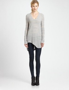 From the HELMUT capsule collection. Lengthy sweater takes on a modern silhouette with subtle distressing, dropped shoulders and an uneven hem. V-neckDropped shouldersLong sleevesAsymmetrical shirttail hem hits below hipsCotton/linen/nylonDry cleanImportedModel shown is 5'11 (178cm) wearing US size Small.