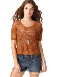 Free People's cropped sweater is absolutely adorable with a flower crochet bodice and a casual fit. Pair it with jeans for a casual, daytime look.