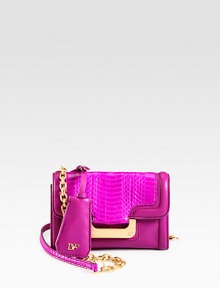 Luxurious snake embossed leather accented with smooth leather and radiant hardware.Chain shoulder strap, 23¼ dropMagnetic snap flap closureOne outside open pocketOne inside zip pocketFully lined7¼W X 5H X 2¼DImported Luxurious snake embossed leather accented with smooth leather and radiant hardware.Chain shoulder strap, 23¼ dropMagnetic snap flap closureOne outside open pocketOne inside zip pocketFully lined7¼W X 5H X 2¼DImported
