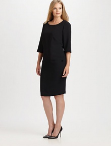 Destined to embrace your shape in all the right places, this crepe dress offers a relaxed-through-the bodice fit and hip-hugging bottom for an alluring look.Round neckElbow-length sleevesThree-quarter sleevesPatch pocketsBack zipperFully linedAbout 24 from natural waistPolyesterDry cleanMade in Italy