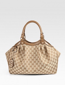 Original GG canvas, leather trim and hardware combine in this top-handle design. Double leather top handles, 7 dropMagnetic snap closureOne inside zip pocketNatural cotton linen lining13W X 10H X 4¾DMade in Italy Original GG canvas, leather trim and hardware combine in this top-handle design. Double leather top handles, 7 dropMagnetic snap closureOne inside zip pocketNatural cotton linen lining13W X 10H X 4¾DMade in Italy