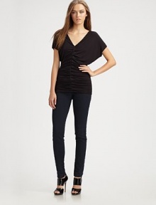 Luxe jersey skims the body in a softly-ruched V-neck.Dropped shouldersShort sleevesCenter ruchingAbout 28 from shoulder to hem94% rayon/6% spandexDry cleanMade in USA