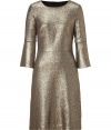 Swing into the new season in 60s style in Goats metallic gold lam? shift - Rounded neckline, 3/4 flared sleeves, hidden back zip, fitted bodice, A-line skirt - Pair with pumps and a jet black clutch