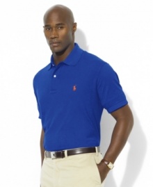 Designed in a relaxed classic fit with lower armholes, a wider body and a longer hem, this short-sleeved polo shirt is rendered in breathable cotton mesh for handsome style. Designed in a relaxed classic fit with lower armholes, a wider body and a longer hem, this short-sleeved polo shirt is rendered in breathable cotton mesh for handsome style.