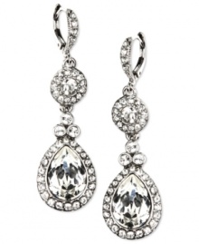 Shimmer that captivates. These glamorous Givenchy earrings are designed with a double drop silhouette that glistens with Swarovski crystal stones. Crafted in imitation rhodium plated mixed metal. Approximate drop: 2-1/8 inches.