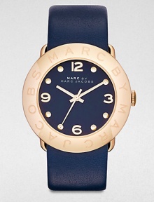 A radiant goldtone ion-plated stainless steel design with a supple leather strap. Quartz movementWater resistant to 5 ATMRound goldtone ion-stainless steel case, 36mm (1.4)Logo engraved bezelNavy dialDot and numeric hour markersSecond hand Navy leather strapImported