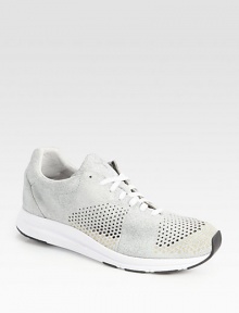 Classic sporty sneaker is reinvented with perforated details set in soft, supple leather.Leather upperPadded insoleRubber soleImported