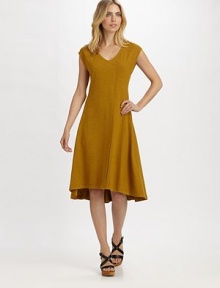 A casual dress that also scores major points in the style category, thanks to its unique wrap-inspired front.V-neckCap sleevesHi-lo hemEasy fitAbout 30 from natural waist55% hemp/45% organic cottonMachine washImported