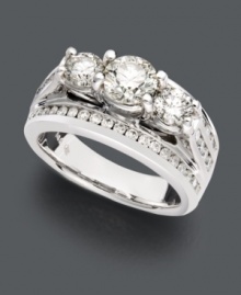 Take her breath away with stunning diamonds and unique design. This sparkling wedding ring features a three stone diamond design lined with channel-set diamonds (2 ct. t.w.). Crafted in 14k white gold. Take her breath away with stunning diamonds and unique design. This sparkling wedding ring features a three stone diamond design lined with channel-set diamonds (2 ct. t.w.). Crafted in 14k white gold.