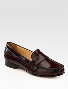 Slip on this preppy favorite rendered in fine leather with a hint of sheen. Leather upperLeather liningLeather and rubber solePadded insoleImported