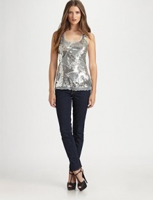 Glittering sequins swirl over the mesh front of this scoopneck tank for a look that's simply-dazzling.ScoopneckWide strapsSequined mesh frontAbout 27 from shoulder to hemFront: 50% viscose/45% rayon/5% lycraBack: rayonDry cleanImportedModel shown is 5'9 (175cm) wearing US size Small.