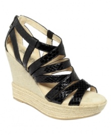 Criss cross and cool. DKNYC's Kendra platform wedge sandals feature an espadrille wedge that's right on time for the season.