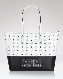 The classic day bag gets an of-the-moment update. In logo-splashed coated canvas, this tote lives to add statement flair to your office to off-duty look. The classic day bag gets an of-the-moment update. In logo-splashed coated canvas, this tote lives to add statement flair to your office to off-duty look.