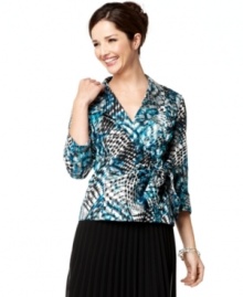 Alex Evenings dresses up this top with a dynamic print and a sweet wrap silhouette, making it ideal for pairing with pants and skirts for special occasions. Alex Evenings dresses up this top with a dynamic print and a sweet wrap silhouette, making it ideal for pairing with pants and skirts for special occasions.