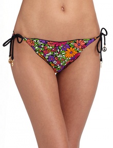 Cheery floral graphics teamed with ruffle edges, make a fun and flirty string bottom.Elastic waistband Side ties with peace charms Ruffle edges Fully lined 82% nylon/18% spandex Fully lined Hand wash Made in USA of imported fabricPlease note: Bikini bottom sold separately. 