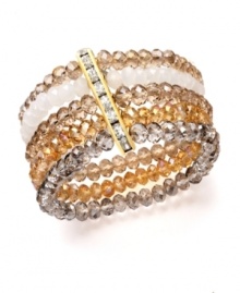 Bring warmth and energy to your ensemble with gold tones and a hint of sparkle. Ali Khan bracelet features five scintillating rows of champagne and neutral-colored glass beads with a row of rhinestone accents. Crafted in gold tone mixed metal. Bracelet stretches to fit wrist. Approximate diameter: 2 inches. Bring warmth and energy to your ensemble with gold tones and a hint of sparkle. Ali Khan bracelet features five scintillating rows of champagne and neutral-colored glass beads with a row of rhinestone accents. Crafted in gold tone mixed metal. Bracelet stretches to fit wrist. Approximate diameter: 2 inches.