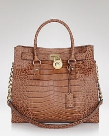 In on-trend croc-embossed leather, this MICHAEL Michael Kors tote takes a tactile approach to practical, day right style. In on-trend croc-embossed leather, this MICHAEL Michael Kors tote takes a tactile approach to practical, day right style.