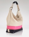 DIANE von FURSTENBERG's leather hobo is a discreet take on covet-worthy color block. Unzip the expandable bag displays peek of pink when the mod-loving mood strikes.