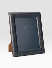 An elegant display for a cherished photo, rendered in supple saddle leather with a nickel-plated brass finish.Holds one 10 X 13 photoLeather and nickel-plated brassImported