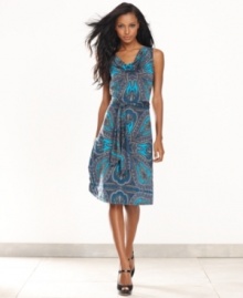 Dazzle from day to play with INC's sleeveless dress, finished by a bold print and belted waist.