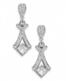 Glamour takes center stage with the Grandeur linear earrings from Eliot Danori. Crafted from rhodium-plated brass, the earrings illuminate with crystal and cubic zirconias (2-1/2 ct. t.w.). Approximate drop: 1-1/2 inches. Glamour takes center stage with the Grandeur linear earrings from Eliot Danori. Crafted from rhodium-plated brass, the earrings illuminate with crystal and cubic zirconias (2-1/2 ct. t.w.). Approximate drop: 1-1/2 inches.