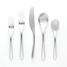 Aura five-piece place setting by Nambé. Made of forged 18/10 stainless steel and polished to a mirror finish, these pieces are exceptionally lustrous, durable and rust resistant. Setting consists of dinner fork, salad fork, knife, teaspoon, and tablespoon. Aura five-piece place setting by Nambé. Made of forged 18/10 stainless steel and polished to a mirror finish, these pieces are exceptionally lustrous, durable and rust resistant. Setting consists of dinner fork, salad fork, knife, teaspoon, and tablespoon.